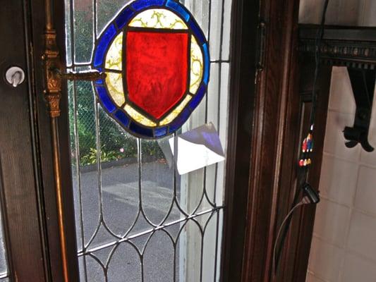 Photo 1: Mishapened, loose french door glass panels