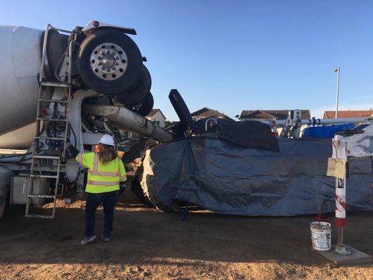 Dumping mud into Boom Pump at jobsite