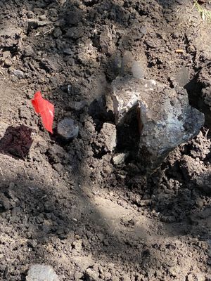 Concrete from an old fence post next to an irrigation head Hoffpauir failed to remove.