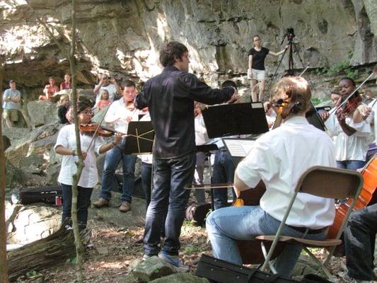 Hike to a Concert conducted by Yaniv Dinur located in the woods near the landmark named Morgan's Steep