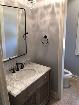 Bathroom remodel , removed wall paper , new vanity and under mount sink and painting