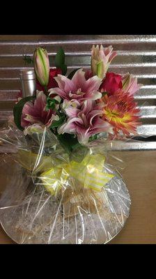 Beautiful floral arrangement with wine and chocolates