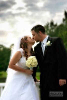 Wedding photography. Kissing at sunset.