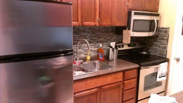 There were multiple coats of paint and varnish on these cabinets before Heath Refinishing worked their magic.  An excellent job!