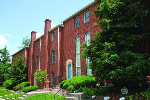 Entryway of our Fairfax Village Townhomes featuring beautiful brick detail.