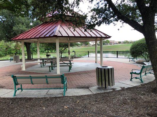 Covered tables and a grill