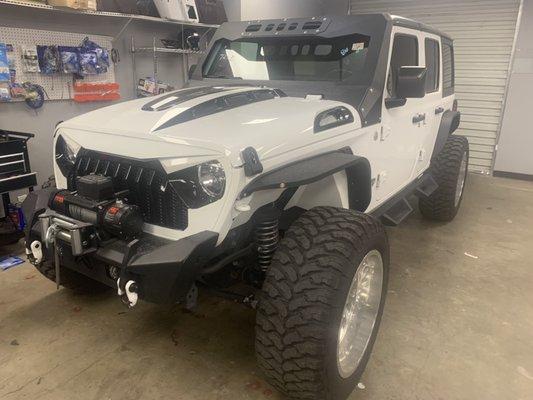 Custom work on a jeep flares wheels tires & led lights