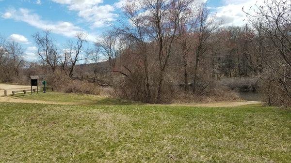 Kayak / canoe launching area on far right, welcome sign on left.