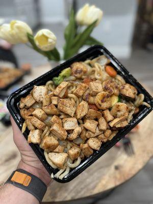 Chicken and shrimp over spicy udon and veggies.