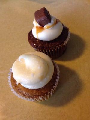 The front cupcake is a pumpkin roll and the back cupcake is snickers.