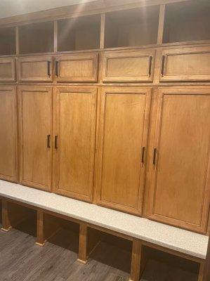 Tore out old bifold cabinets and installed new custom mudroom cubby cabinets