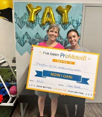 Lauren Celebrates with her patient with a Graduation Photo