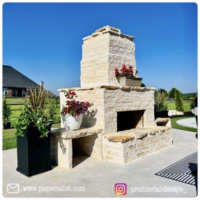 Custom outdoor fireplace and patio design along with installation.