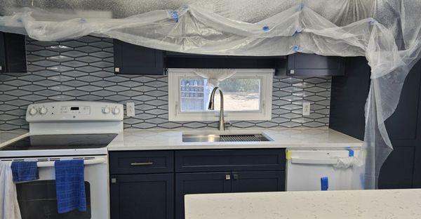 Installed the kitchen backsplash tiles.