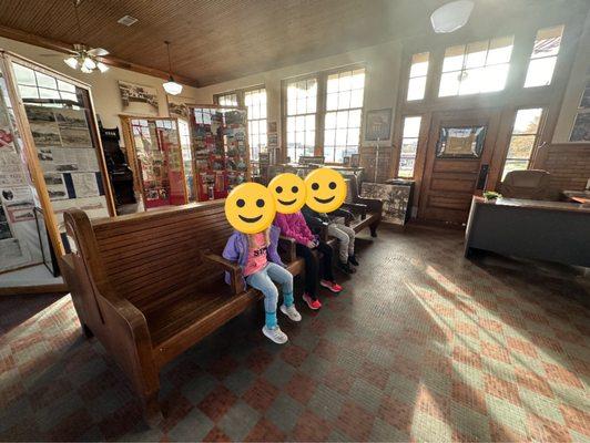 Bench with arm rests.