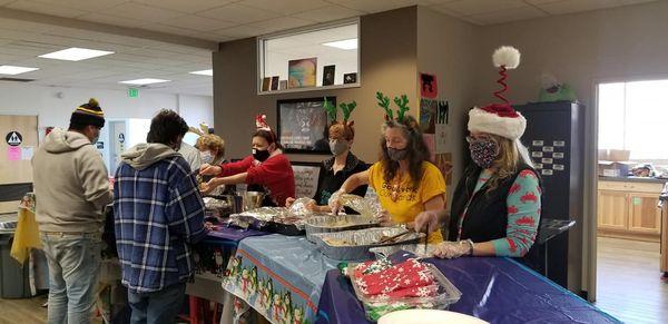 Serving the homeless youth at our annual holiday luncheon where we provide essentials for the unhoused youth in our community.