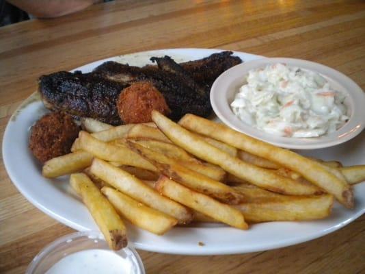 blackened catfish filets, coleslaw, hush puppies and fries