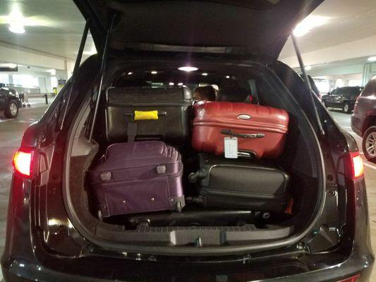 Transporting 5 Large Bags and 4 Carry-on and 4 Passengers at Sedan Rate