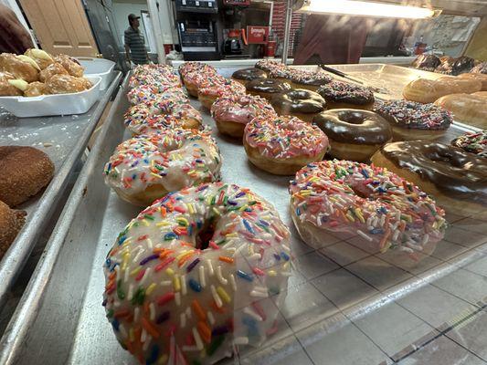 Freshly made sprinkle donuts