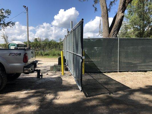 UPS storage yard custom 30' cantilever gates and bollards.