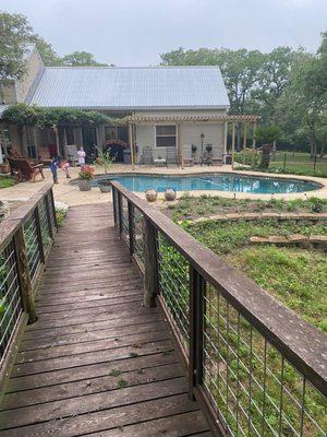 The pool and the beautiful home behind it.