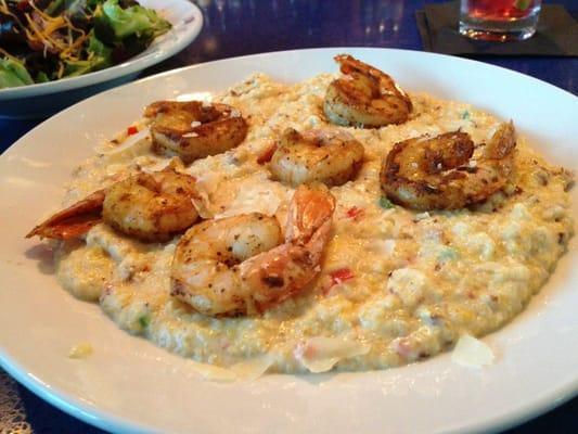 Shrimp and grits. Topped with bacon, sautéed peppers topped with parm cheese. One of chef Tonys special items!