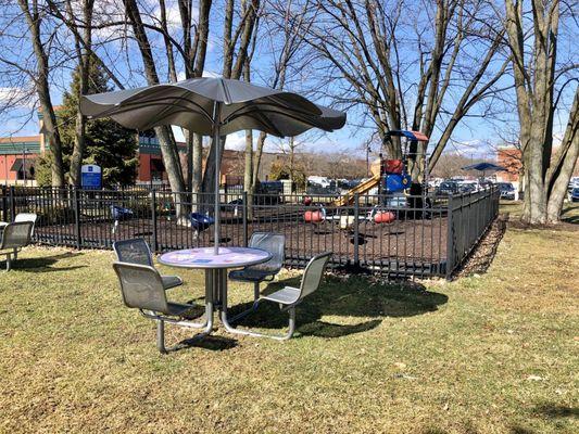 Picnic tables outside the play area