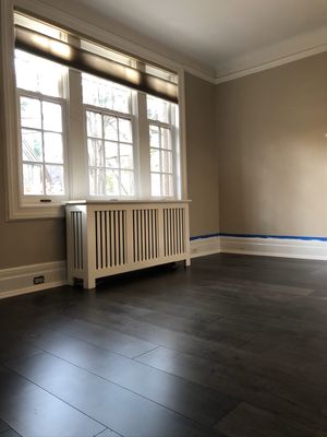 Existing hardwood and subflooring removed, new plywood with leveling installed. And Prefinished engineered wood floor installed on top.