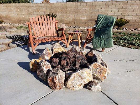 Beach-style boulder firepit in Menifee by American Heritage Pool Corporation