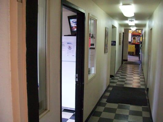 A behind the scenes look at the mechanics' break room on the left. The hallway leads to the service bay.