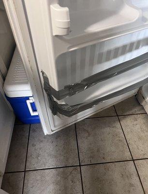 Refrigerator has duct tape on door, no lights in refrigerator or freezer also the top of the bottom shelf extremely nasty