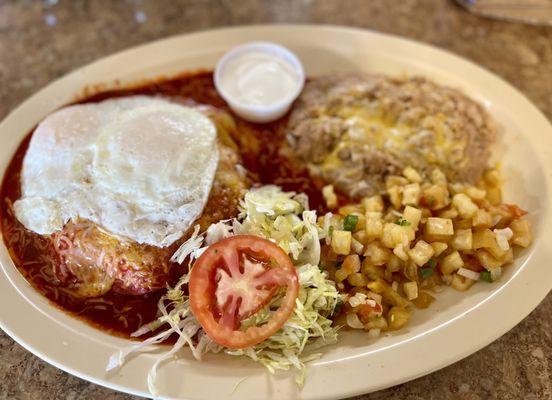 Enchiladas montadas over easy eggs