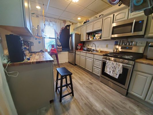 Sand, paint cabinets
Add cabinet
Add new flooring