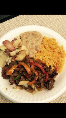 Steak fajitas, Mexican rice, roasted potatoes, received beans