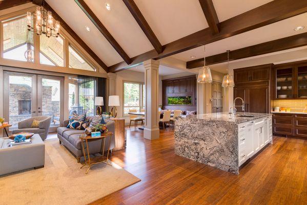 A sample of a listing photo in a mountain home with vaulted ceilings and natural light from windows.