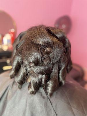 Silk press with curls on textured hair