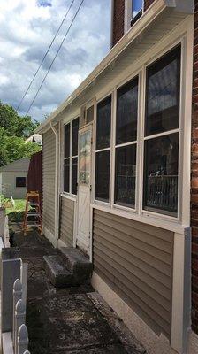 New storm windows, soffit, fascia and seamless rain gutter installation.