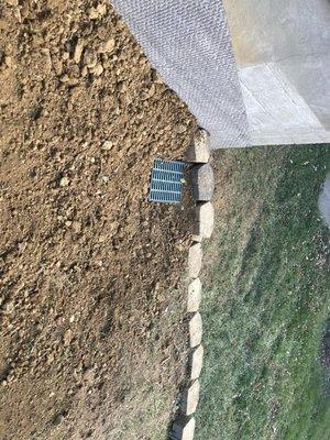 Area drain on a steep Hillside after foundation Drainage installed.