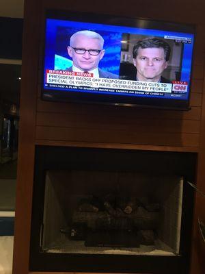 Fireplace and tv at hotel lobby