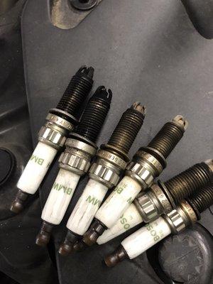 Fouled spark plugs, due to leaking fuel injectors.