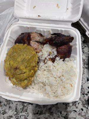 Medio Pollo a la Brasa with rice and tostones