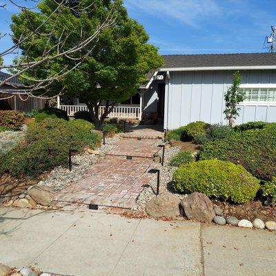 New brick front steps plus a whole new sprinkler system installed by Golden Roots Landscape