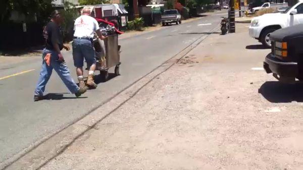 Pushing the motorcycle pieces off his property after giving us the run around