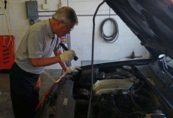 Mr. Lee checking out my car.