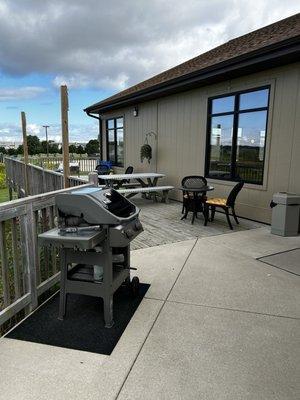 Deck with tables, chairs and BBQ