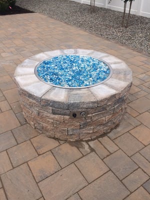 Outdoor Fireplace install with Aqua Iridescent fire glass