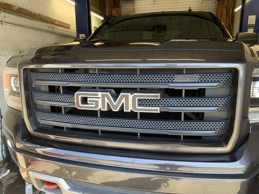 Blacked out emblem and chrome grill inserts