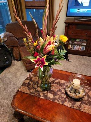 This is just one of two of the arrangements my son made for less than $70.00. He put this company to shame.