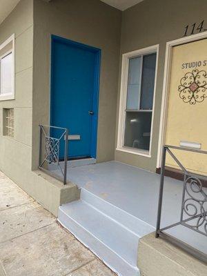 Look for the blue door!