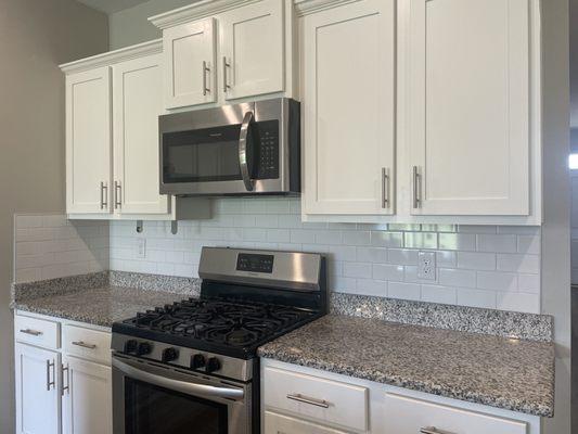 White ceramic subway tile with white grout.